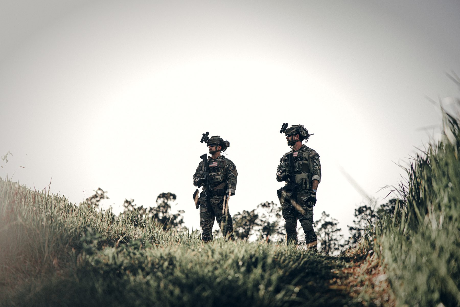 Two operators on a ridge at first light.