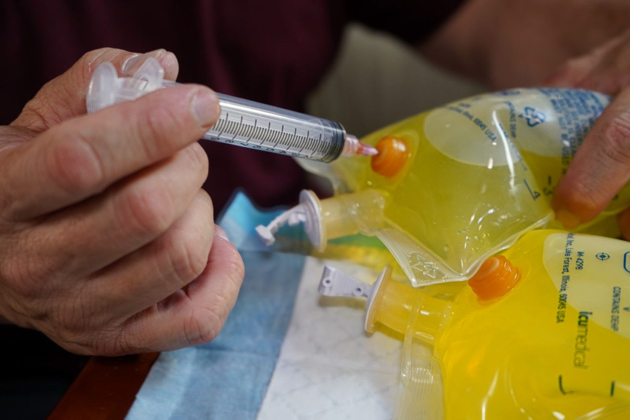 Vitamins drawn into an IV bag before placement